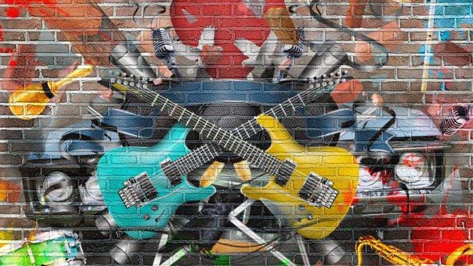 Bunte Mural-Kunst mit Gitarren auf Backsteinwand Wandbild mit Gitarren und Musikmotiven